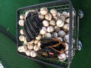 professional major league baseballs and gloves close up  at a secret sports training camp facility